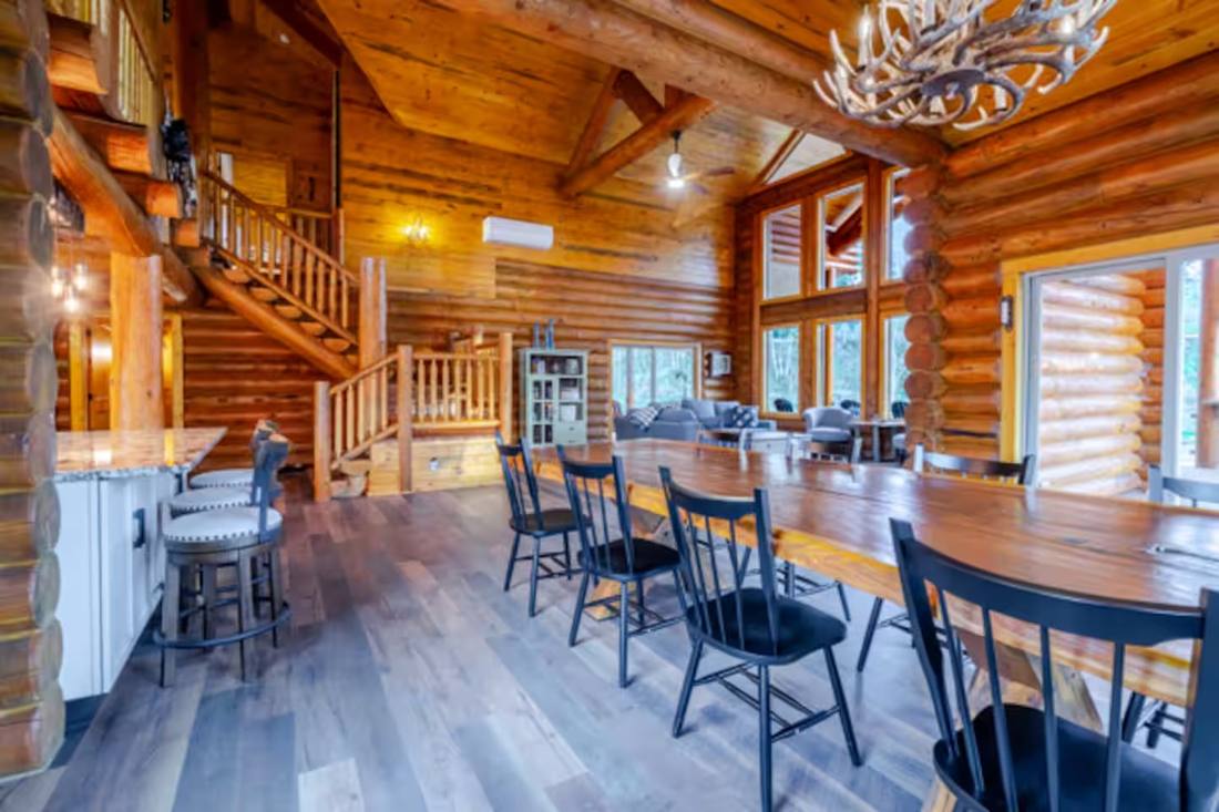 Dining table beneath the timber beams