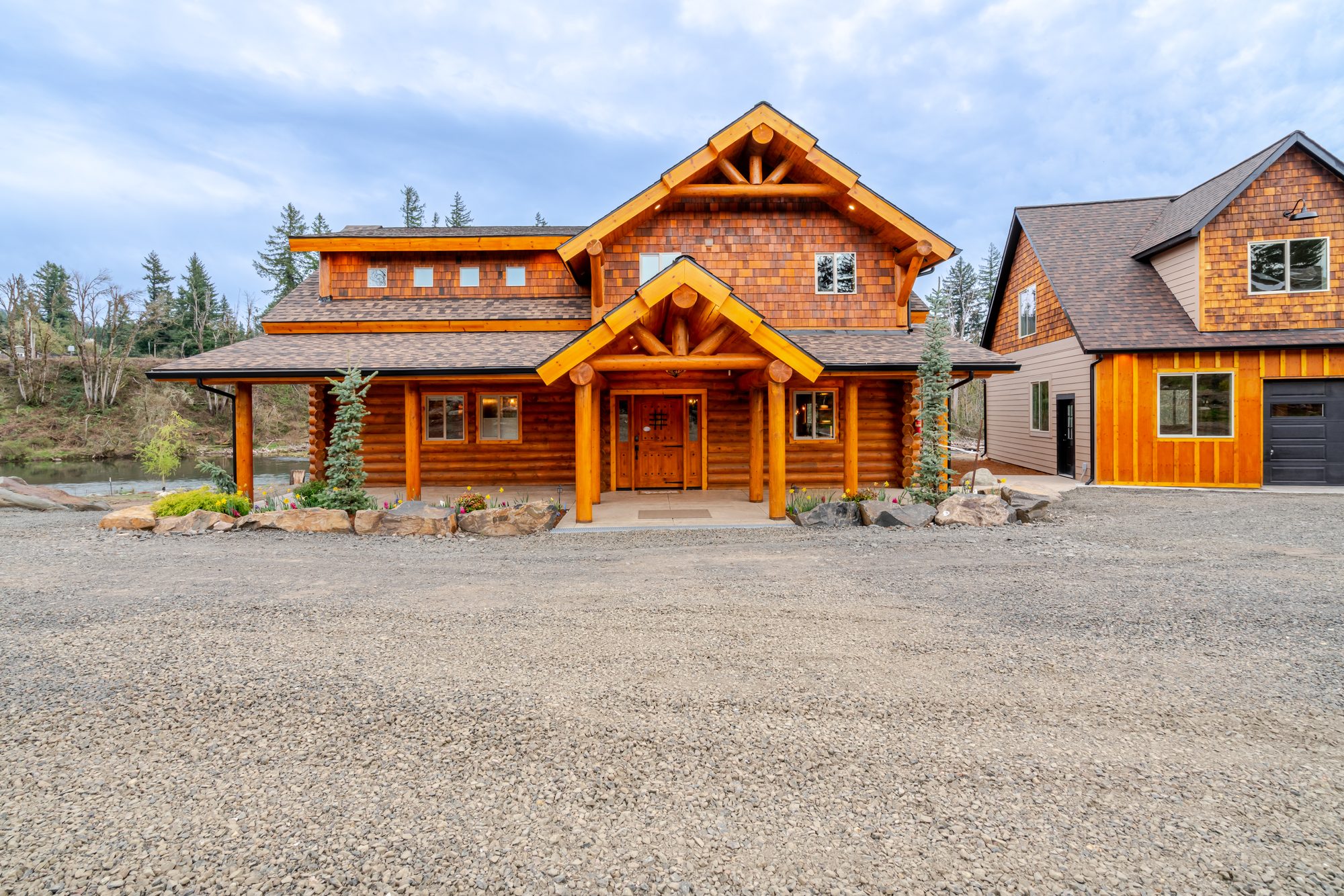 The River Lodge — the handcrafted log home by day
